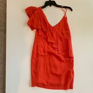 Coral colored mini dress. Ruffle on one shoulder. Size small.